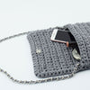 

Ribbon Clutch-Handtasche
2