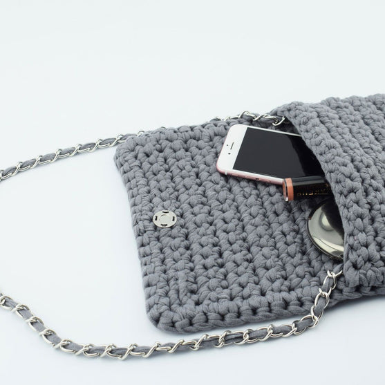 

Ribbon Clutch-Handtasche
2