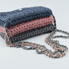 

Ribbon Clutch-Handtasche
3