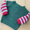 

Baby Elf - Weihnachtspullover und - Mütze
5